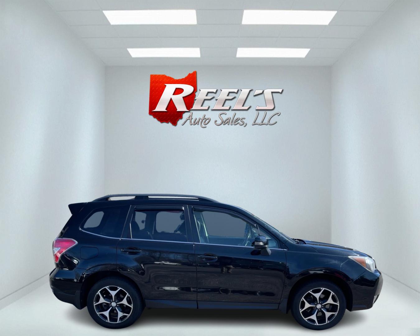 2014 Black /Black Subaru Forester 2.0XT Touring (JF2SJGMC4EH) with an 2.0L H4 SOHC 16V TURBO engine, Automatic transmission, located at 547 E. Main St., Orwell, OH, 44076, (440) 437-5893, 41.535435, -80.847855 - This 2014 Subaru Forester 2.0XT Touring is a well-equipped compact SUV featuring a powerful 2.0L turbocharged engine matched with a continuously variable transmission (CVT) for a blend of performance and efficiency. It boasts a range of high-end amenities, including heated seats, X-Mode for enhanced - Photo#4